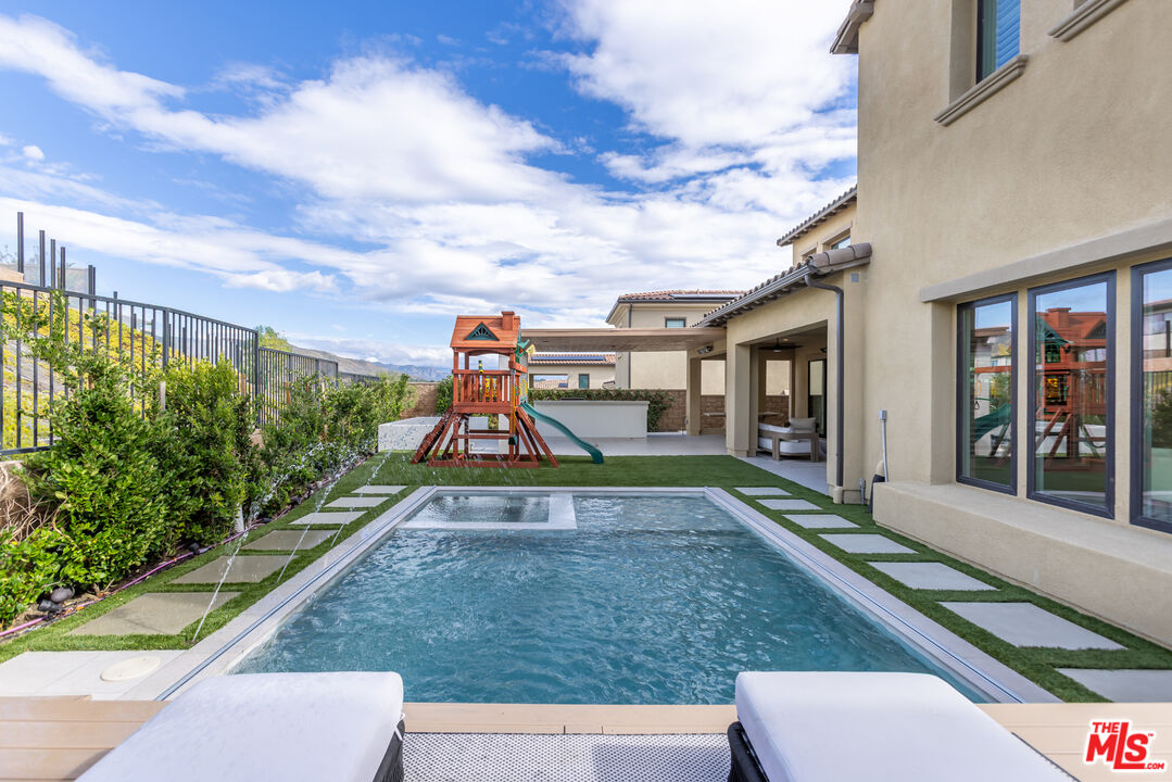 11734 Manchester Way Porter Ranch, CA 91326 - Photo 27 of 35 a view of a house with entertaining space