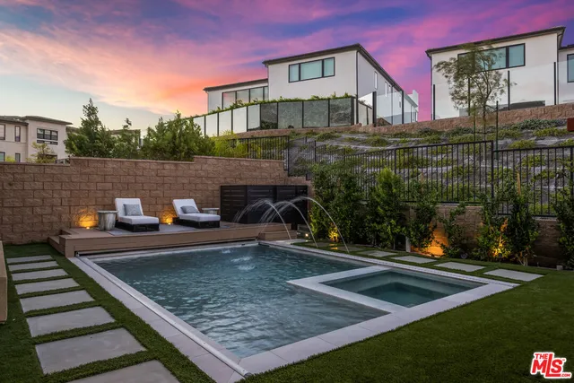 a view of a wooden deck with yard