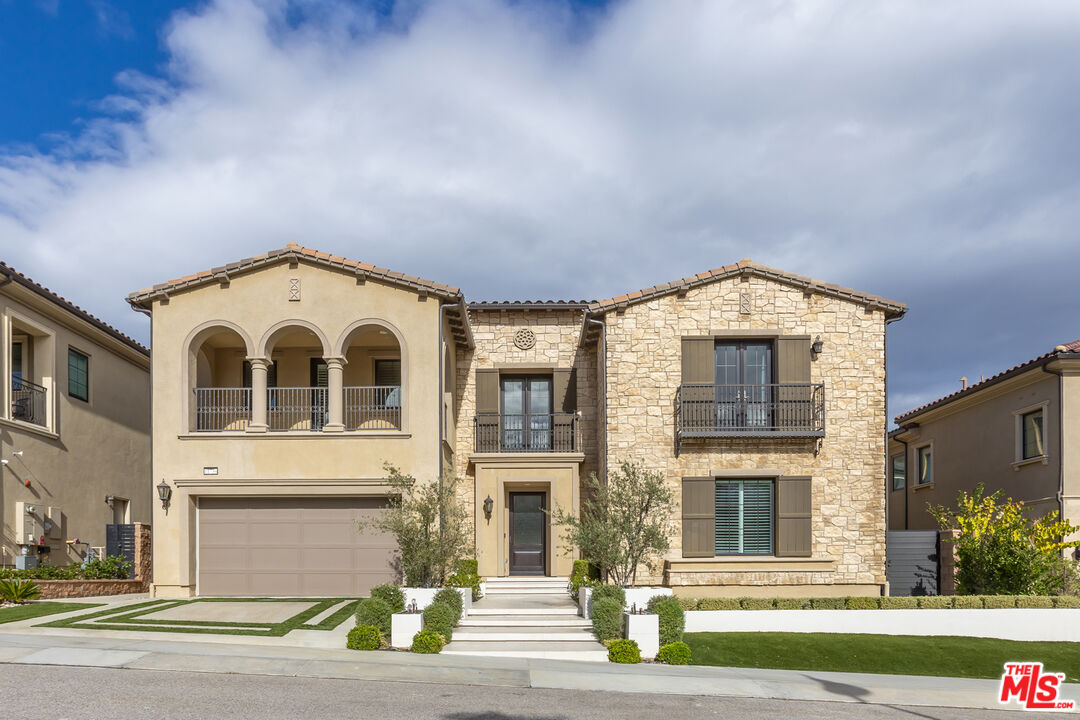 11734 Manchester Way Porter Ranch, CA 91326 - Photo 3 of 35 a view of a brick house with a large windows