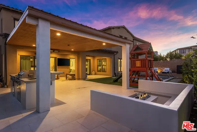 a swimming pool with outdoor seating and yard