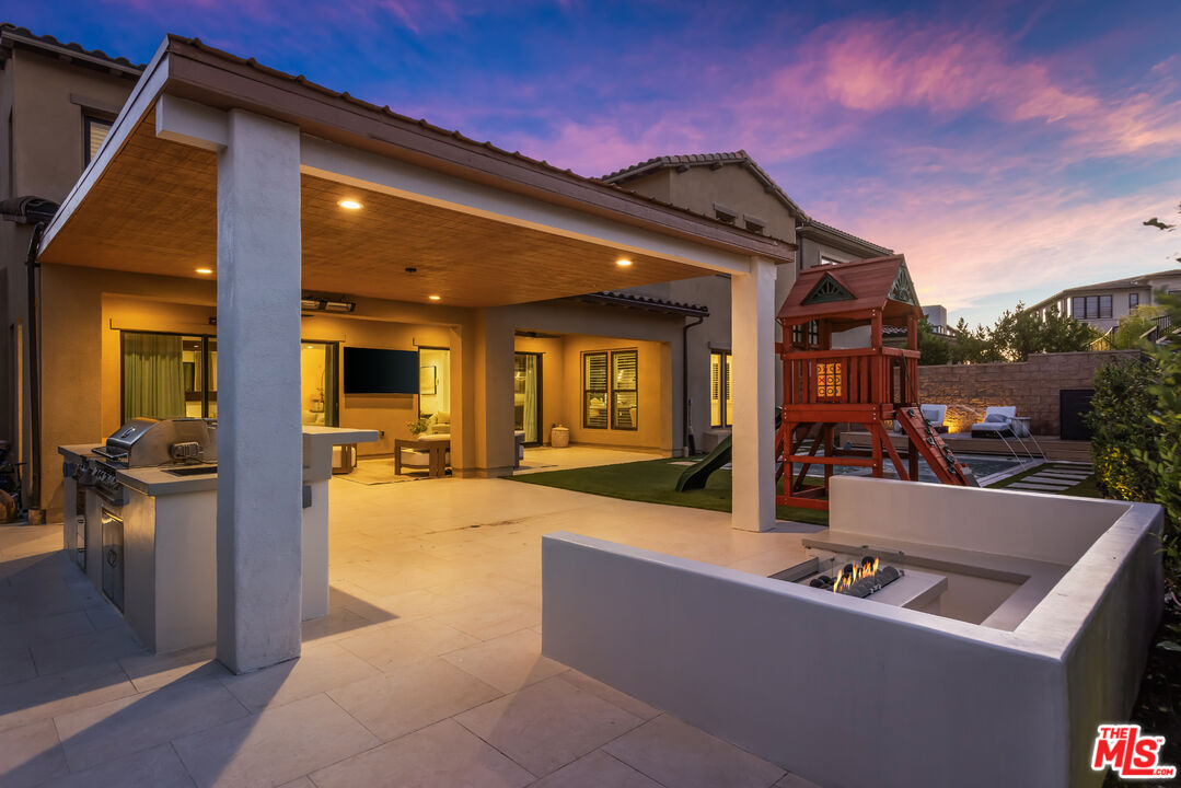 11734 Manchester Way Porter Ranch, CA 91326 - Photo 32 of 35 a swimming pool with outdoor seating and yard