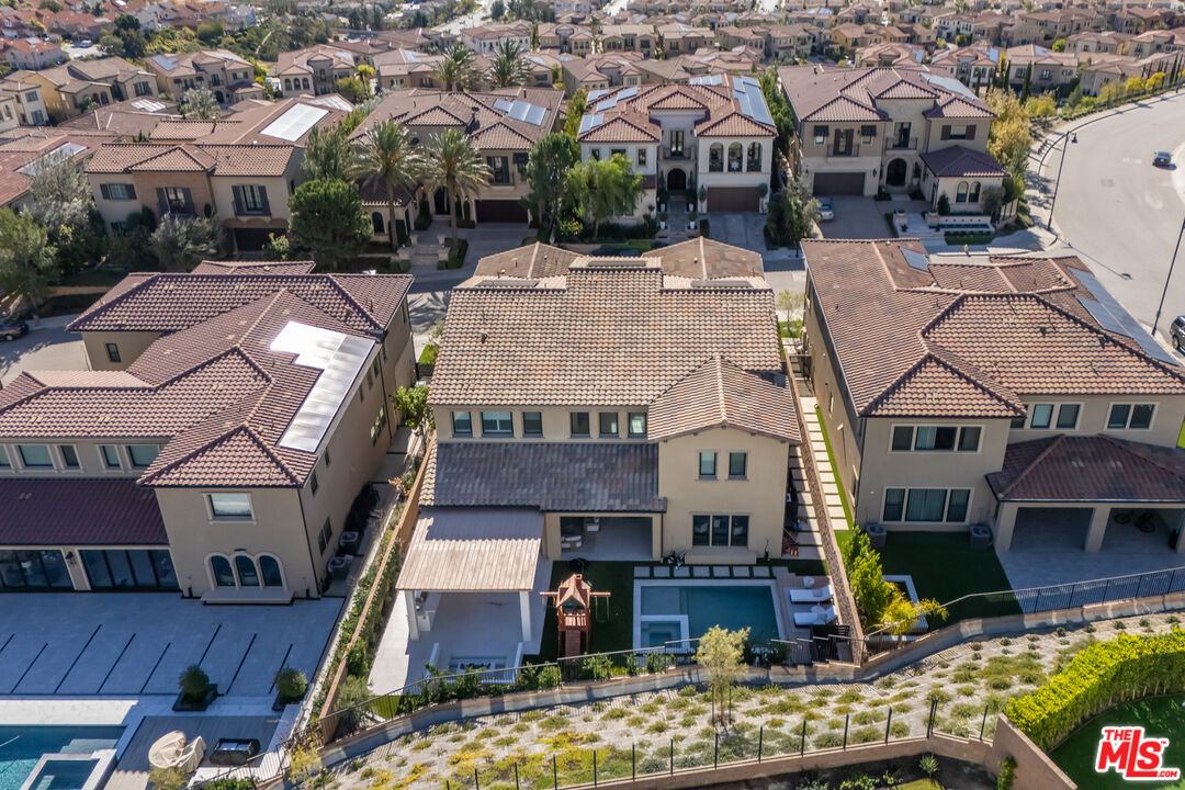 11734 Manchester Way Porter Ranch, CA 91326 - Photo 34 of 35 a view of multiple houses with a yard