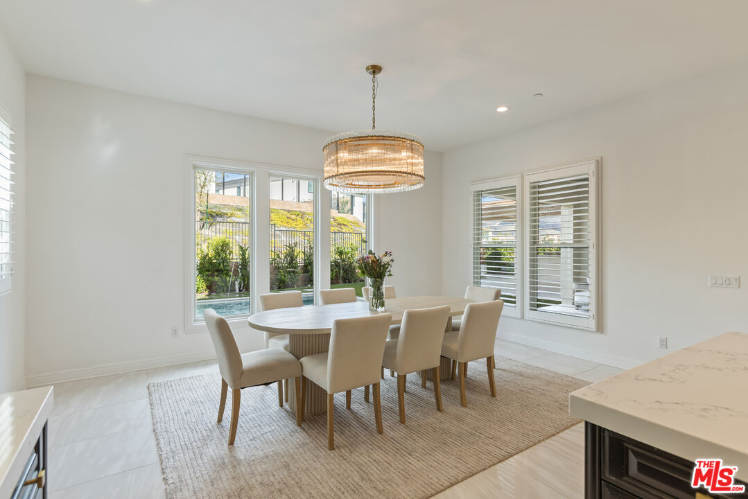 11734 Manchester Way Porter Ranch, CA 91326 - Photo 10 of 35 a view of a dining room with furniture window and outside view