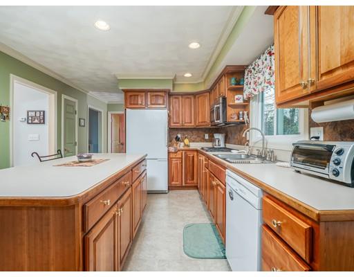 16 Rolling Hill Road Billerica, MA 01821 - Photo 3 of 27 a kitchen with stainless steel appliances granite countertop a sink and a refrigerator
