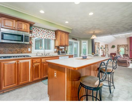 16 Rolling Hill Road Billerica, MA 01821 - Photo 4 of 27 a large kitchen with lots of counter space and dining table