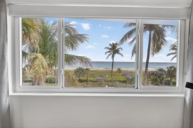 a view of a entryway door with a tree