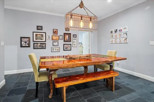 a view of a dining room with furniture and window