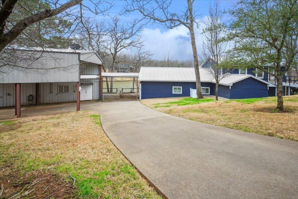 154 Bayside Circle Malakoff, TX 75148 - Photo 5 of 40 a view of a backyard with large trees