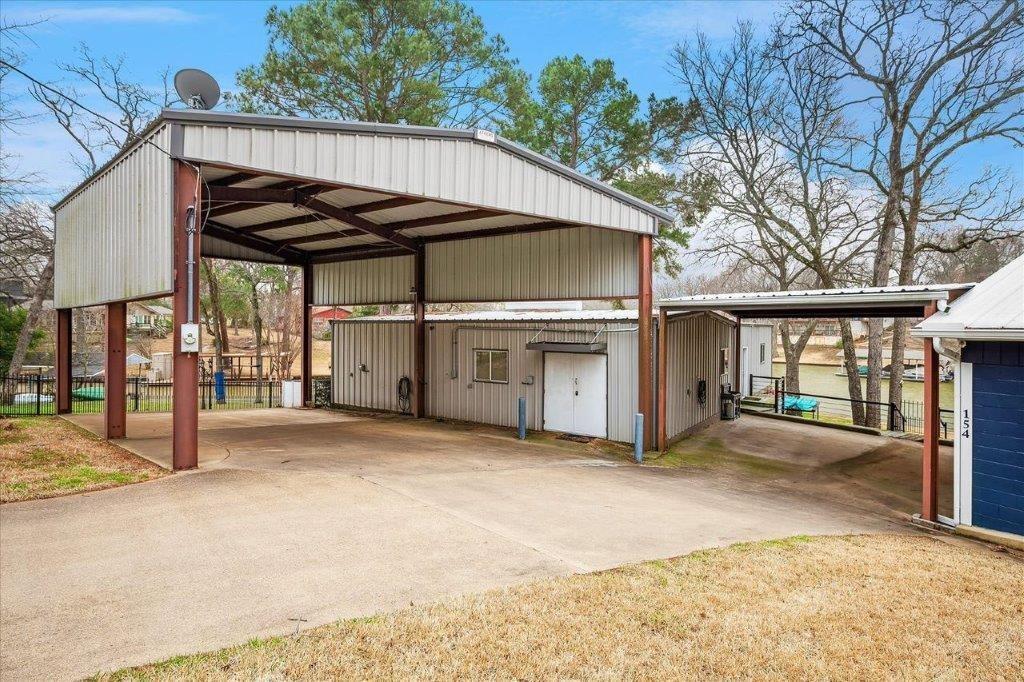 154 Bayside Circle Malakoff, TX 75148 - Photo 6 of 40 a view of a house with a backyard and a patio