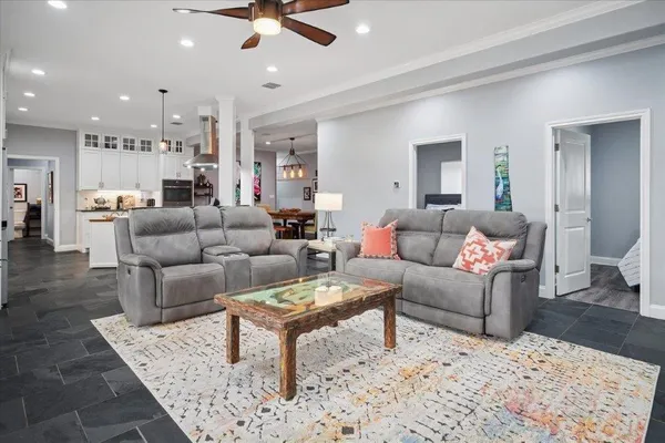 a living room with furniture and a rug