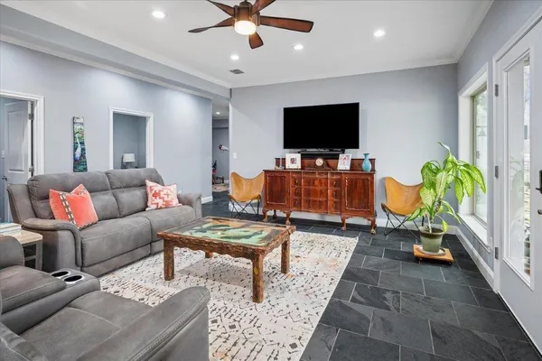 a living room with furniture and a flat screen tv
