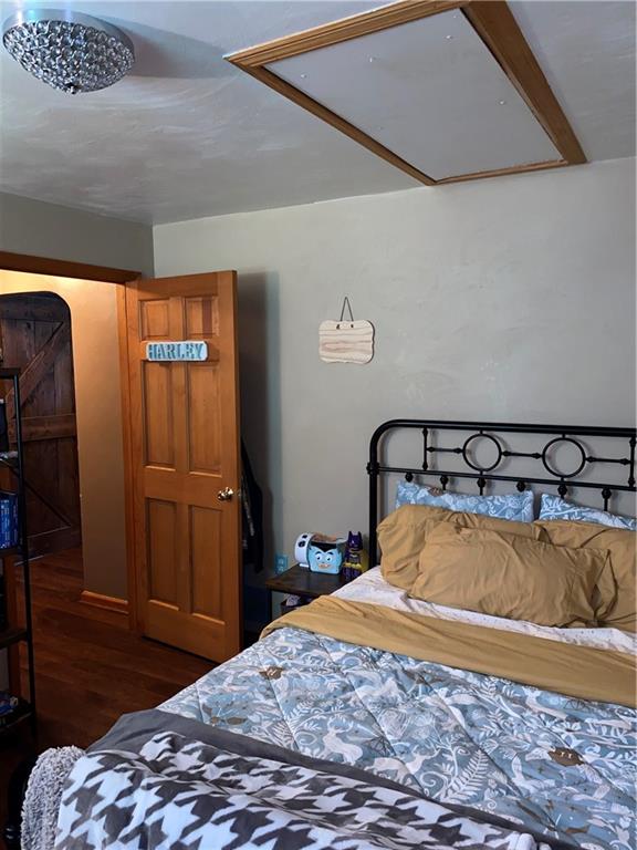 219 Clarke Road Claysville, PA 15323 - Photo 14 of 23 a bedroom with a bed and wooden floor