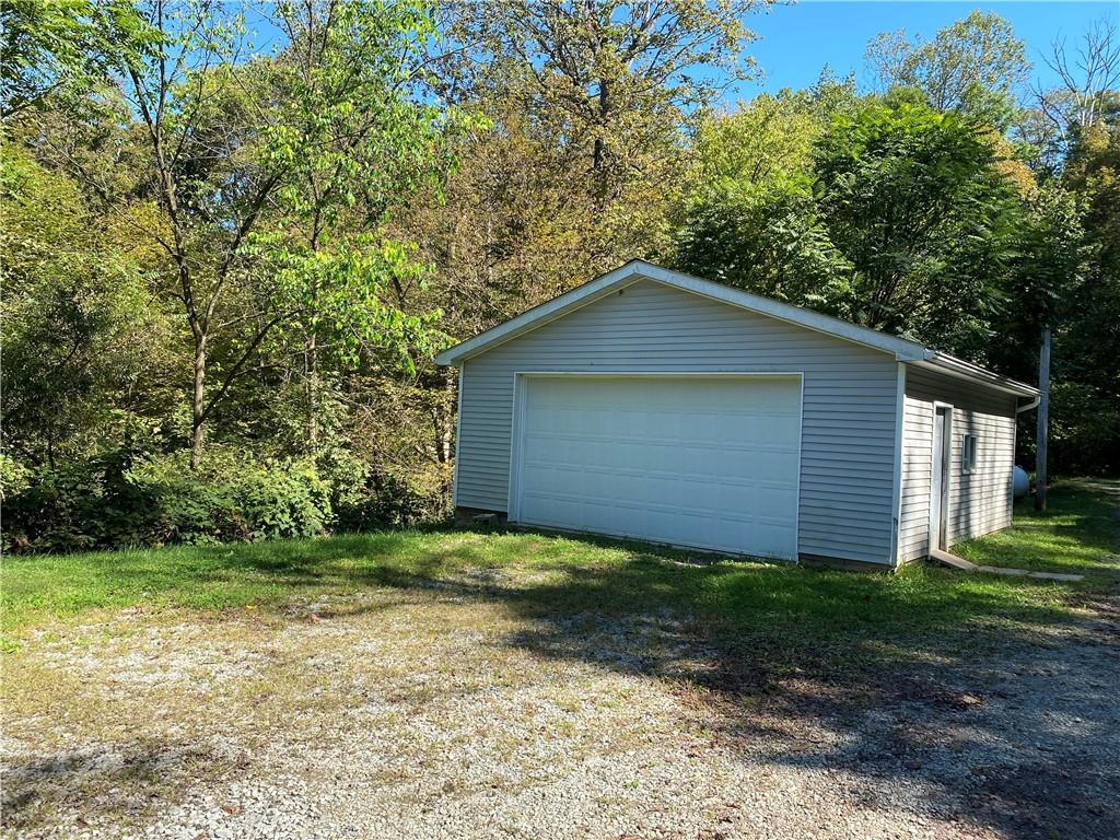 219 Clarke Road Claysville, PA 15323 - Photo 5 of 23 a view of a house with a yard and large trees