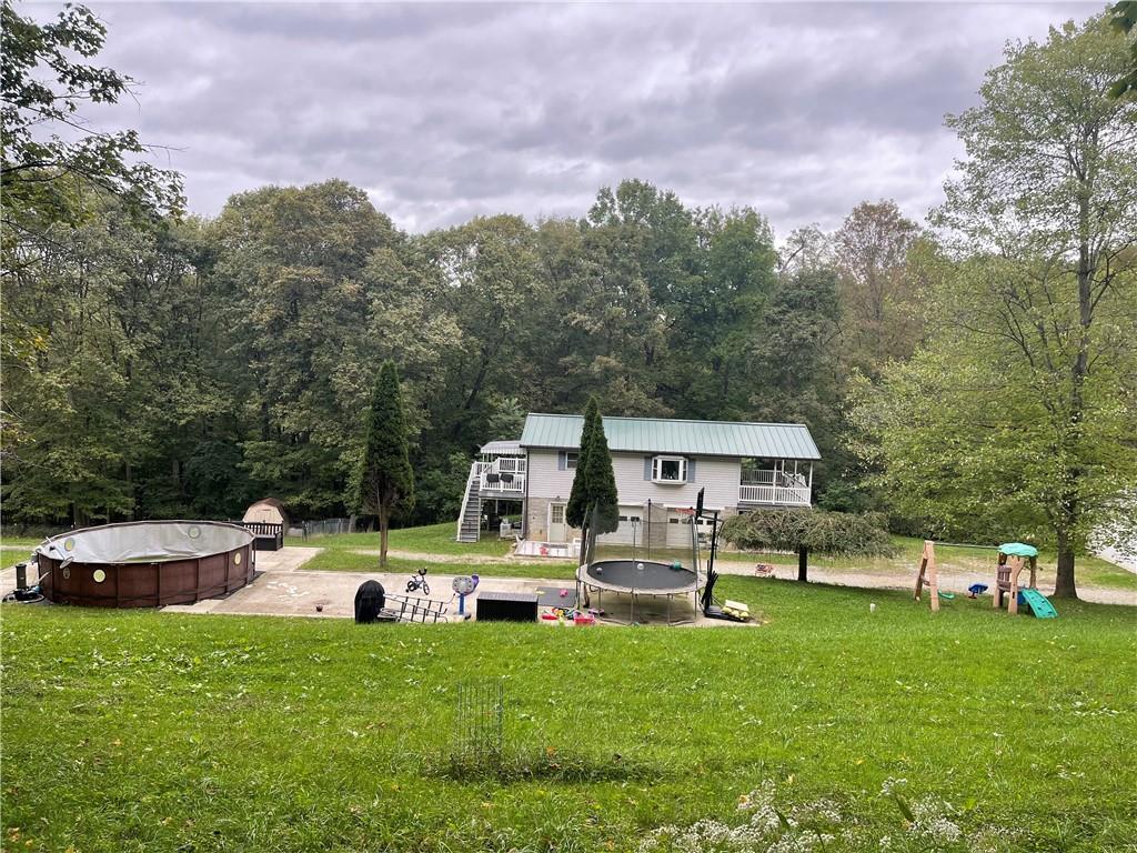 219 Clarke Road Claysville, PA 15323 - Photo 6 of 23 a view of a house with backyard and sitting area