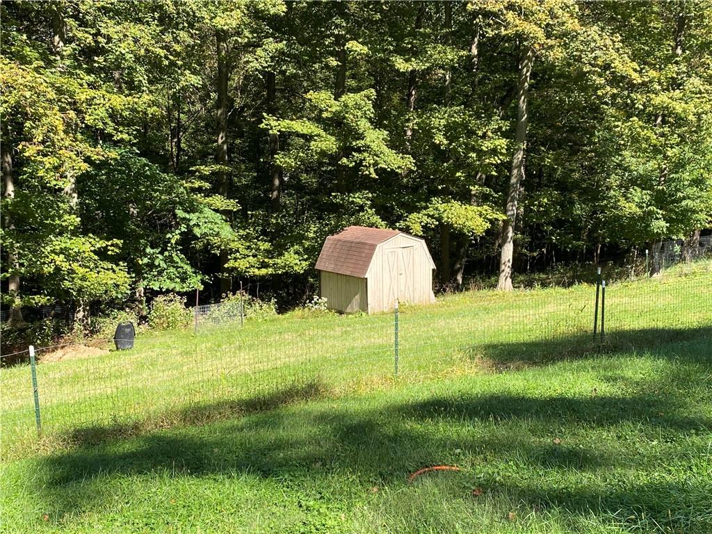 219 Clarke Road Claysville, PA 15323 - Photo 9 of 23 a backyard of a house with swimming pool and trees