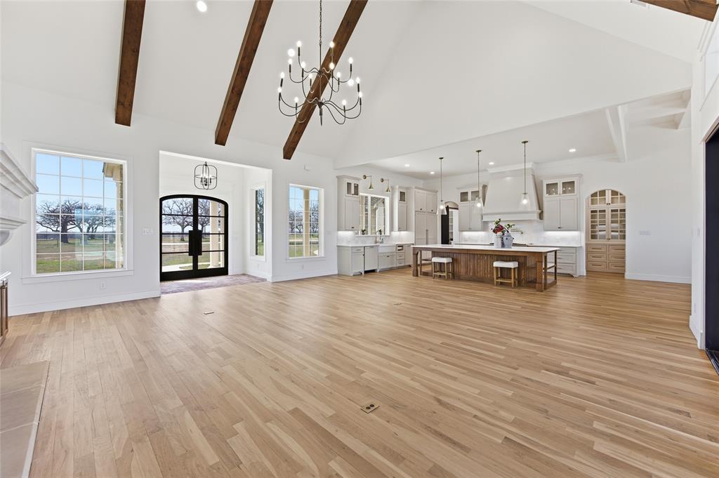 623 Lake Valley Road Sunset, TX 76270 - Photo 12 of 40 a view of a living room and kitchen with furniture