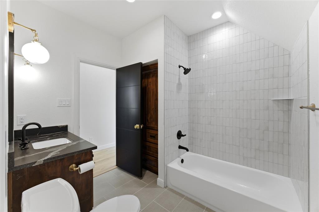 623 Lake Valley Road Sunset, TX 76270 - Photo 27 of 40 a bathroom with a sink toilet and shower