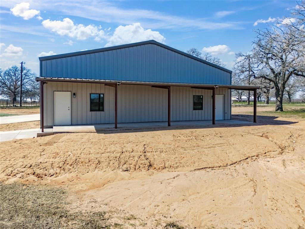 623 Lake Valley Road Sunset, TX 76270 - Photo 6 of 40 a front view of a house with a yard
