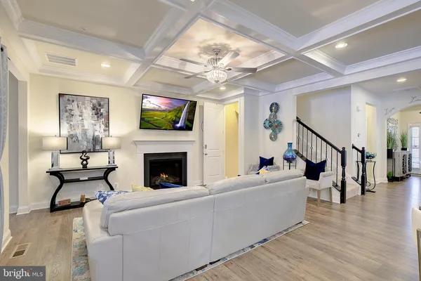 a living room with fireplace furniture and a flat screen tv