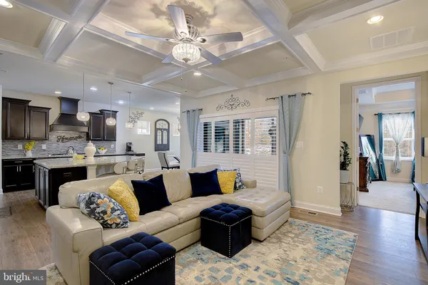 a living room with furniture fireplace and a flat screen tv