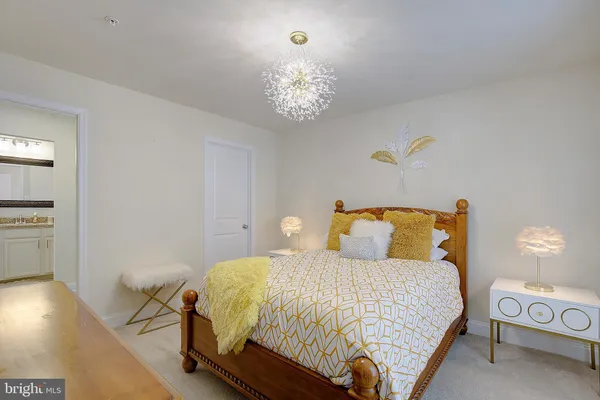 a workspace with a couch and a potted plant