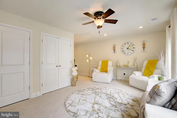 a livingroom with workspace couch and a window