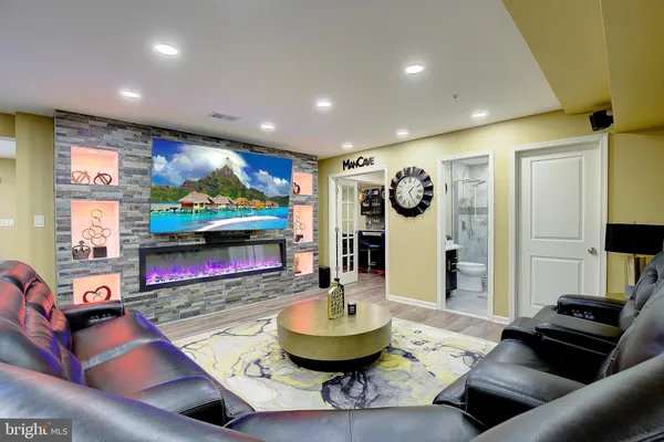a living room with kitchen furniture and a wooden floor