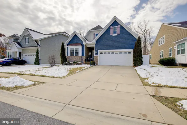 a view of a house with snow in the background
