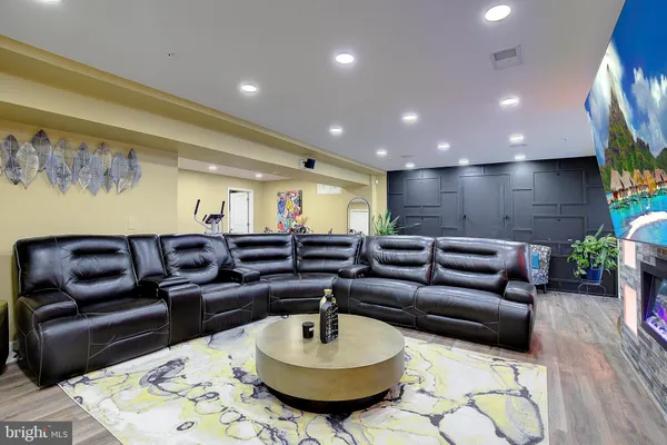 a large kitchen with a table and chairs in it