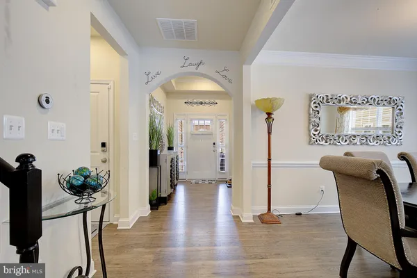 a view of a livingroom with furniture and wooden floor