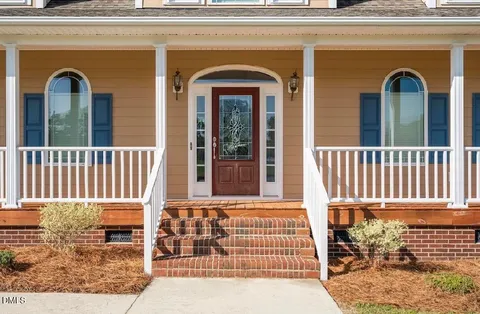 a front view of a house with a porch