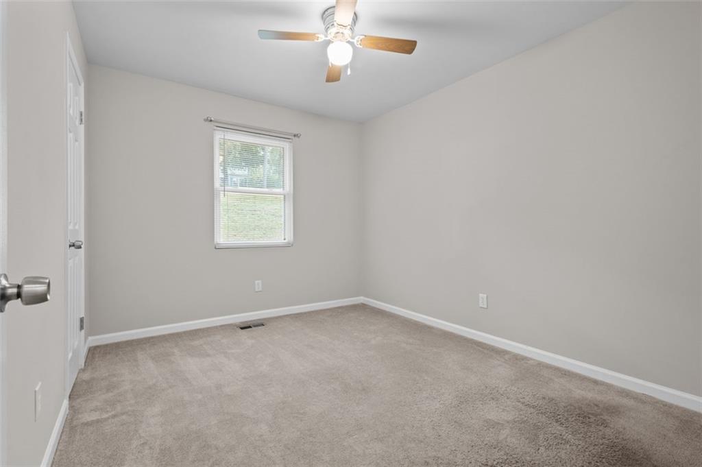 8990 Tweeddale Drive Winston, GA 30187 - Photo 13 of 26 an empty room with a window