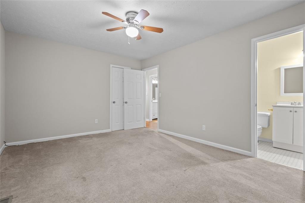 8990 Tweeddale Drive Winston, GA 30187 - Photo 17 of 26 a view of an empty room with a fan