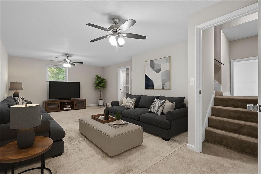 8990 Tweeddale Drive Winston, GA 30187 - Photo 23 of 26 a living room with furniture and a flat screen tv