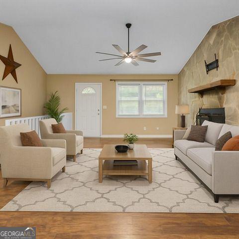 8990 Tweeddale Drive Winston, GA 30187 - Photo 6 of 26 a living room with furniture and a chandelier