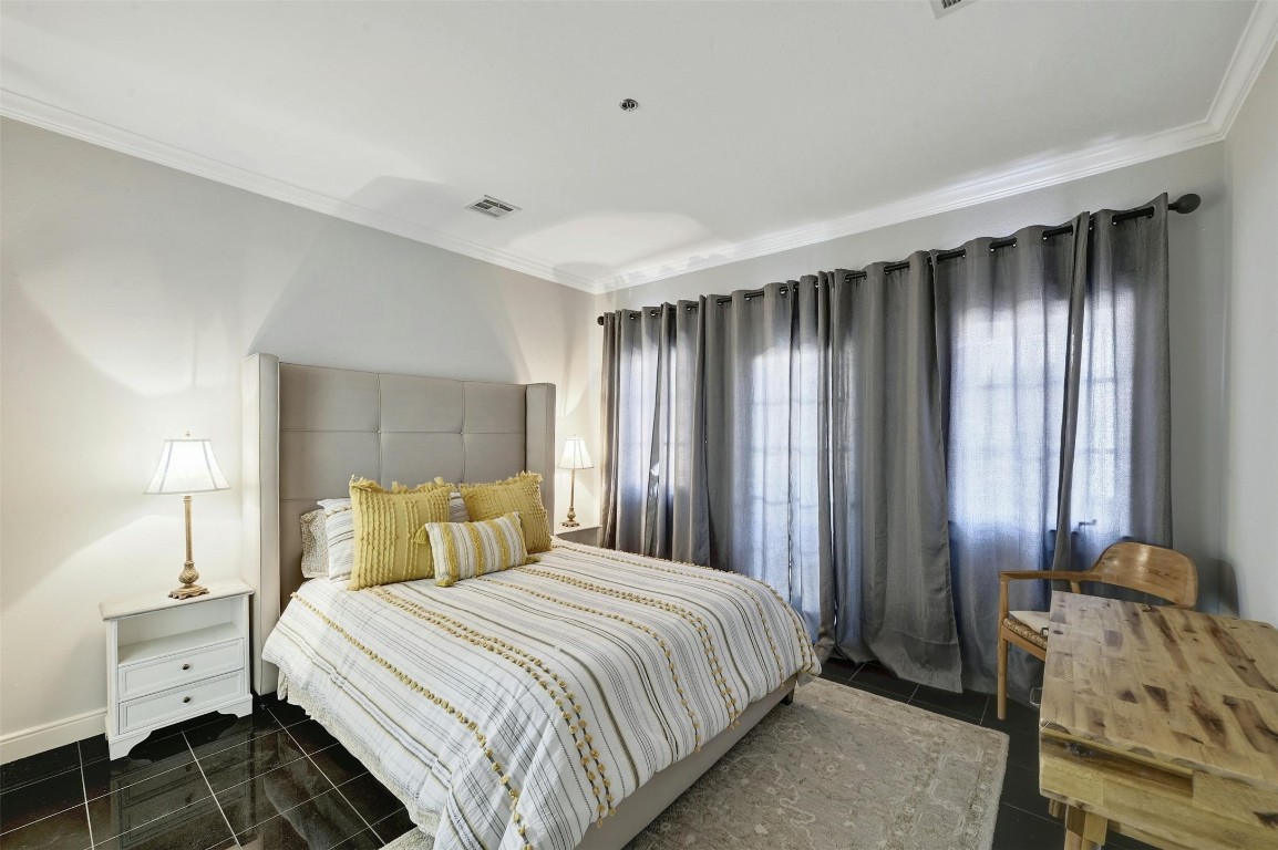 1937 Rue De St Tropez, Unit 9 Austin, TX 78746 - Photo 13 of 33 a bedroom with a bed and a window