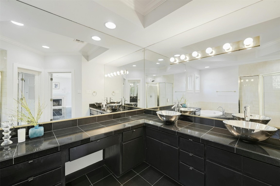 1937 Rue De St Tropez, Unit 9 Austin, TX 78746 - Photo 20 of 33 a bathroom with a sink double vanity and a mirror