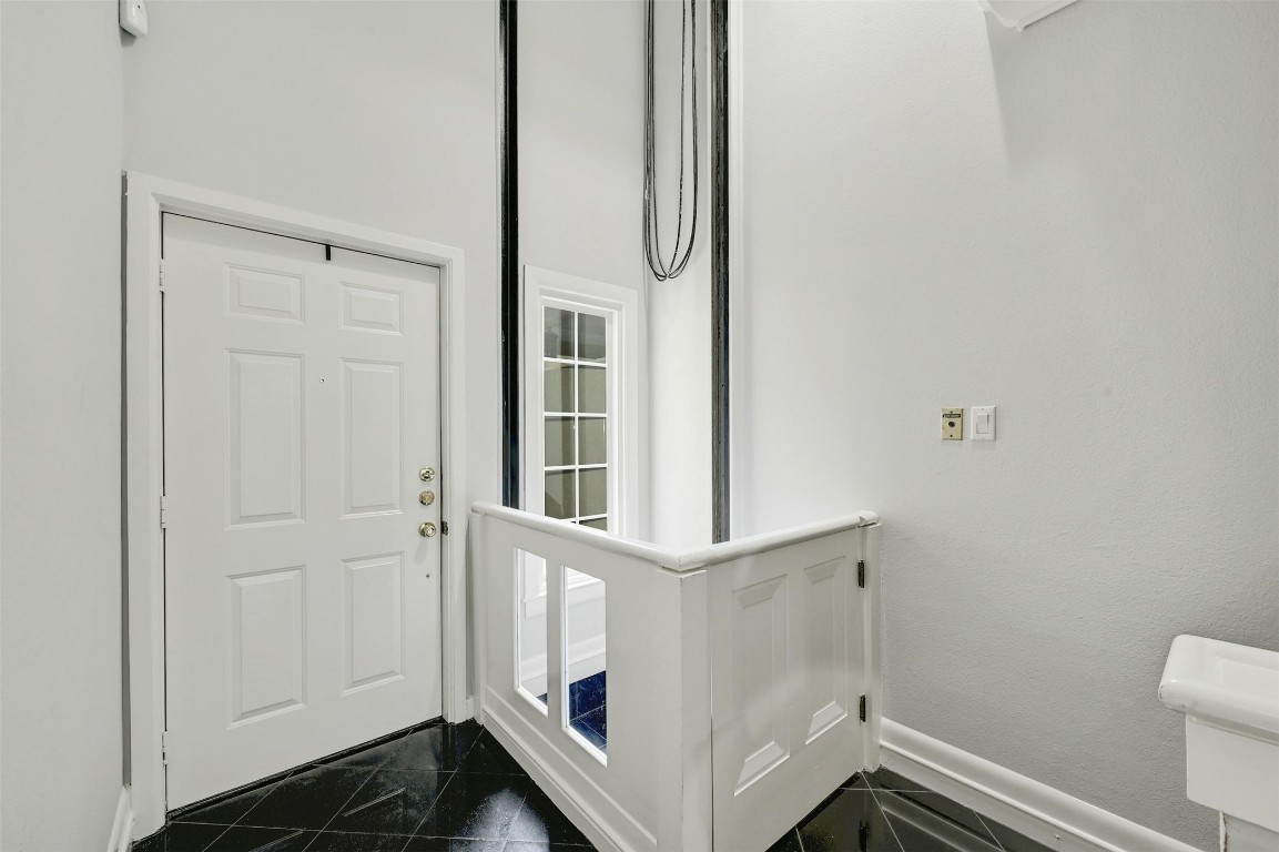 1937 Rue De St Tropez, Unit 9 Austin, TX 78746 - Photo 23 of 33 a bathroom with a sink and mirror
