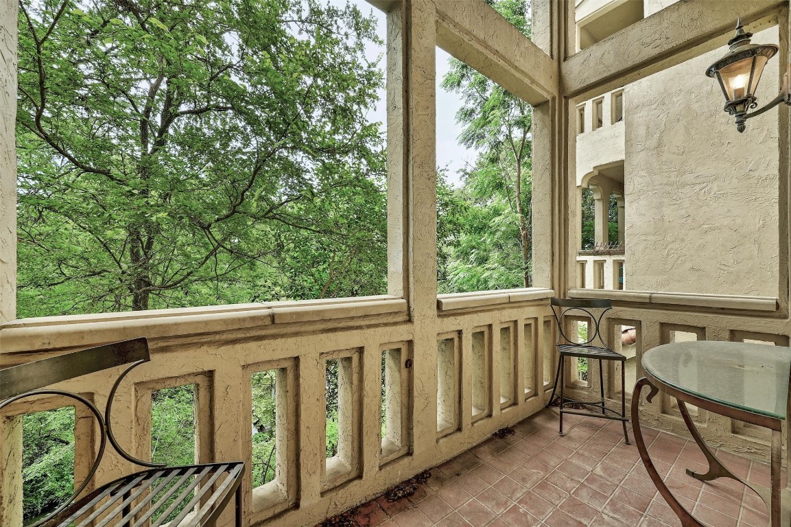 1937 Rue De St Tropez, Unit 9 Austin, TX 78746 - Photo 9 of 33 a view of a balcony with chairs