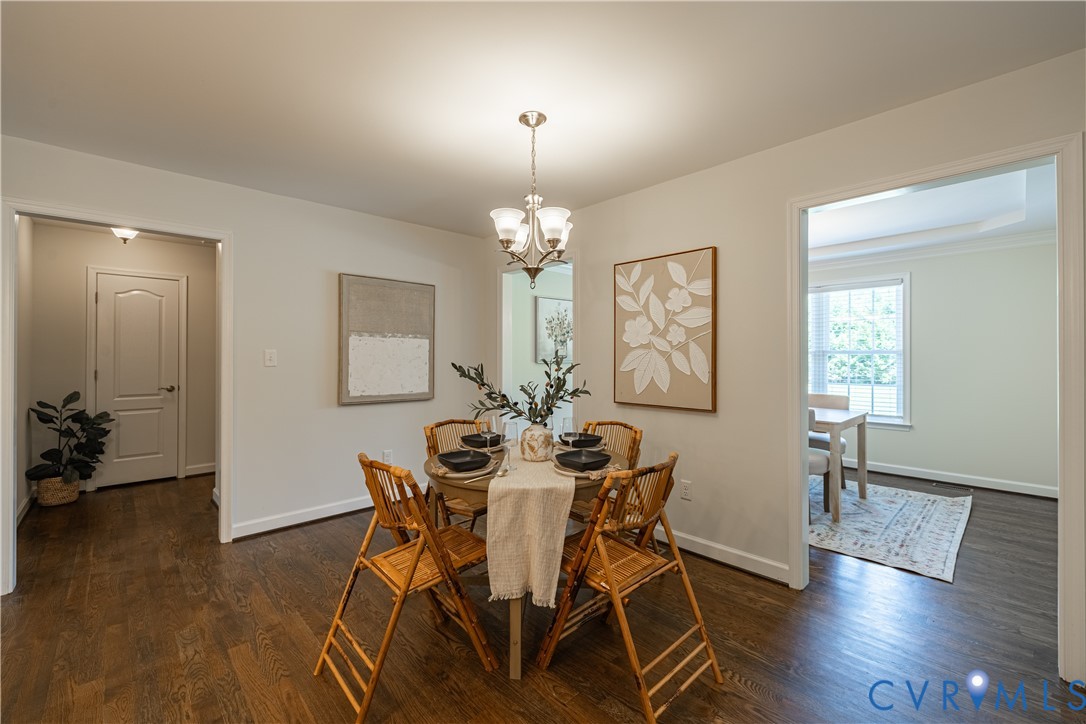 Dining area featuring wood-finish flooring, a cont