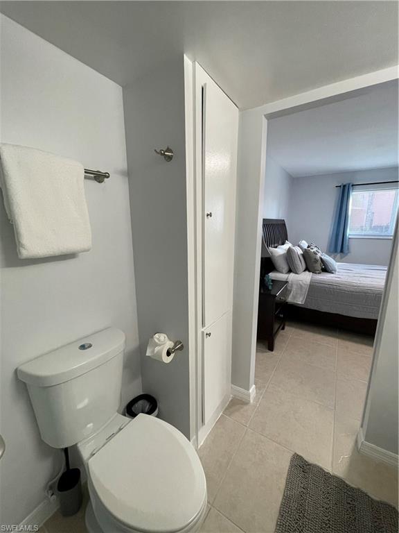 170 Turtle Lake Court, Unit 103 Naples, FL 34105 - Photo 19 of 37 a bathroom with a toilet sink and shower