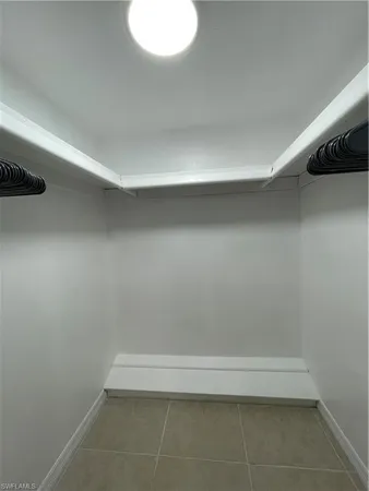 a bedroom with bed and a couch