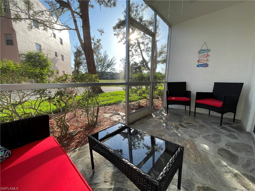 170 Turtle Lake Court, Unit 103 Naples, FL 34105 - Photo 27 of 37 a view of a balcony with chairs