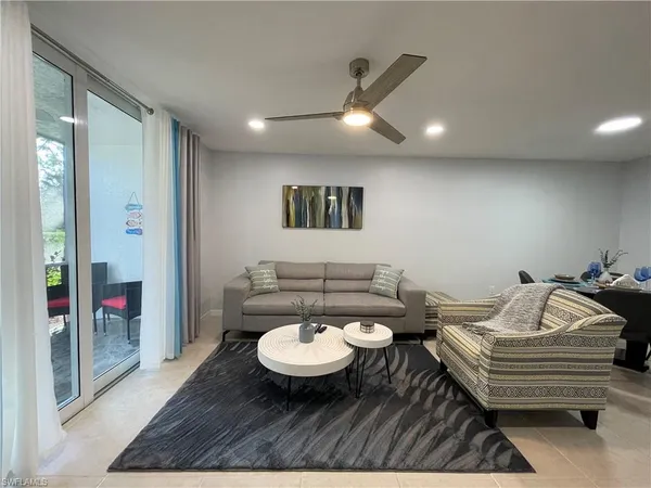 a living room with a couch and a table with wooden floor