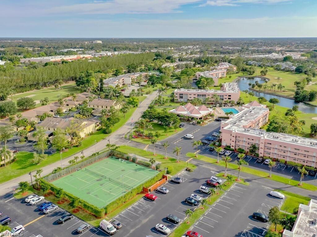 170 Turtle Lake Court, Unit 103 Naples, FL 34105 - Photo 36 of 37 an aerial view of residential houses with outdoor space