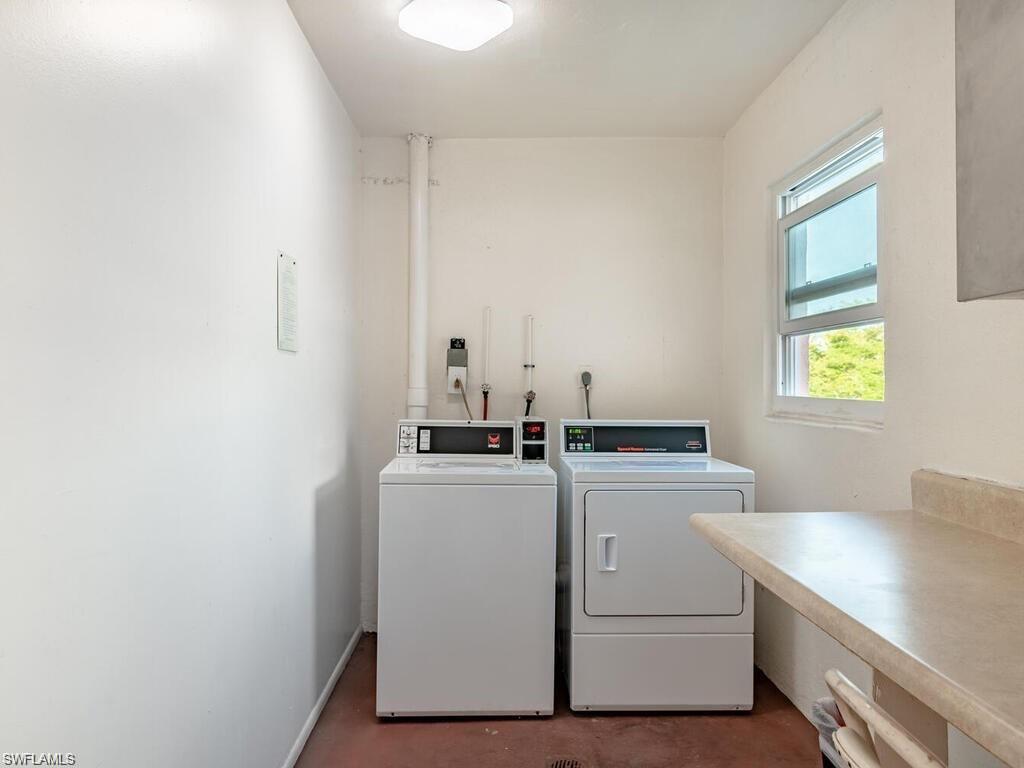 170 Turtle Lake Court, Unit 103 Naples, FL 34105 - Photo 37 of 37 a utility room with dryer and washer
