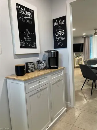 a kitchen with a refrigerator and a stove