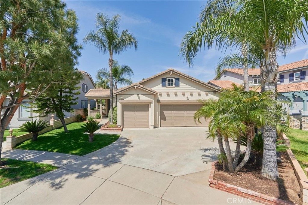 7820 Amarone Place Rancho Cucamonga, CA 91739 - Photo 1 of 1 a front view of a house with garden