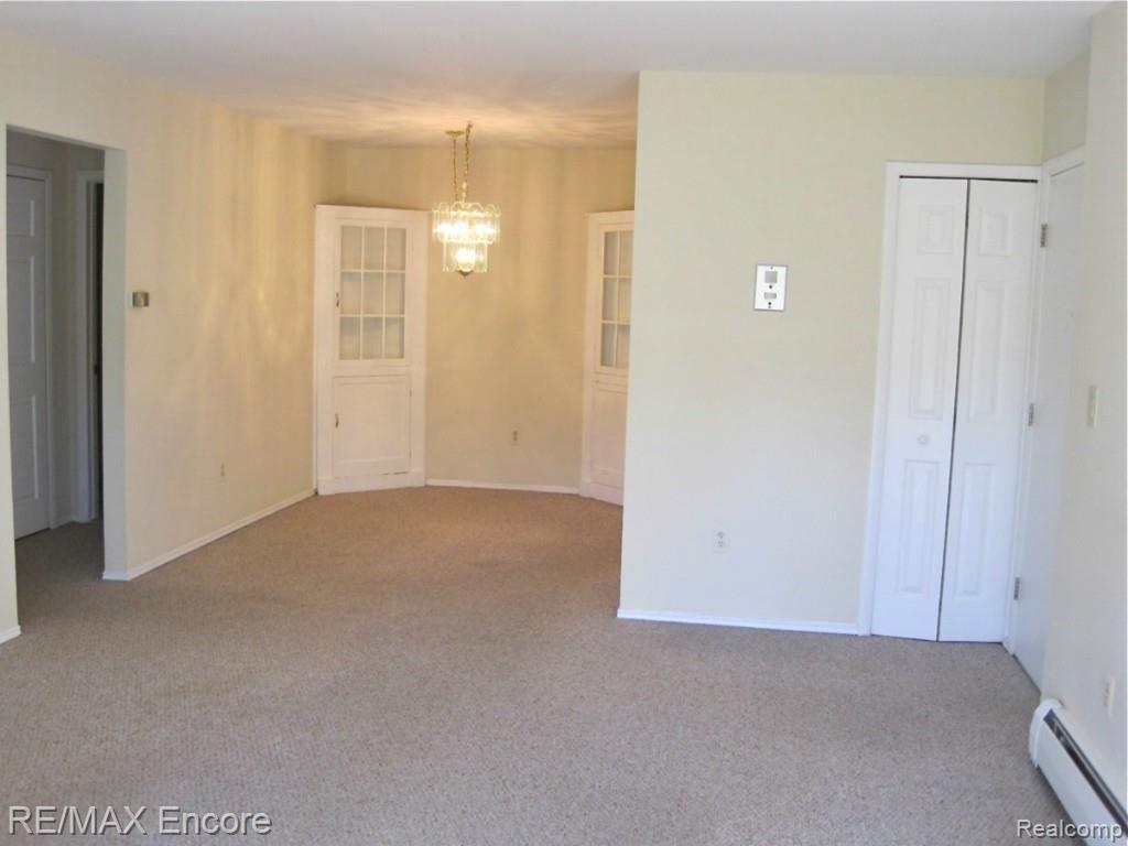 4921 Crooks Road, Unit 96 Royal Oak, MI 48073 - Photo 11 of 19 Living room view to dining room
