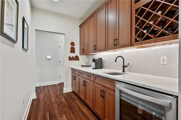 a kitchen with a sink and cabinets